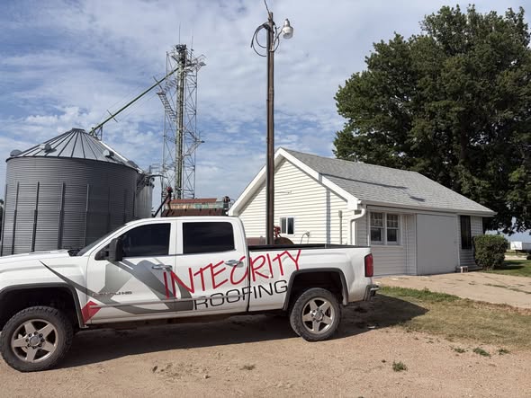 Integrity Roofing truck on site at farmstead re-roof project